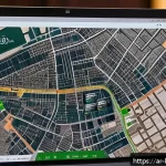 부동산 실거래가 조회 - A modern digital real estate platform interface displayed on a sleek computer screen, showing an int...